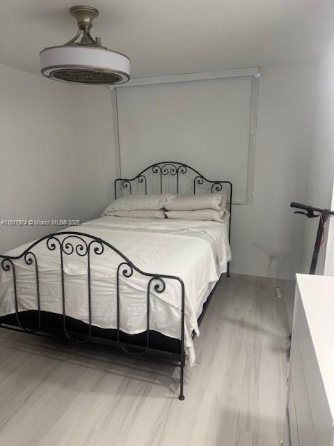 6039 Collins Ave Unit 1516, Miami Beach, FL 33140 - bedroom featuring light wood-style flooring