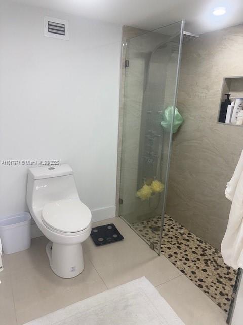 6039 Collins Ave Unit 1516, Miami Beach, FL 33140 - full bath with a shower stall and tile patterned floors
