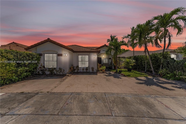 12350 NW 7th Trl, Miami, FL 33182 - mediterranean / spanish-style home featuring a tiled roof and stucco siding