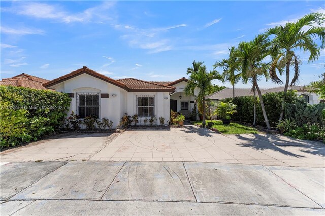 12350 NW 7th Trl, Miami, FL 33182 - back of house featuring a tiled roof and stucco siding