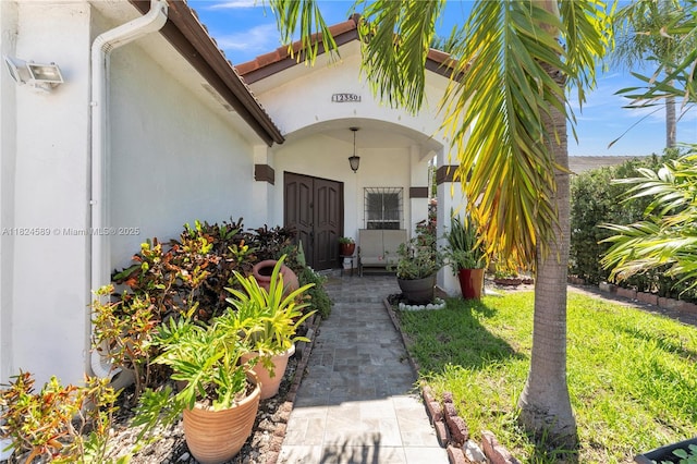 12350 NW 7th Trl, Miami, FL 33182 - view of exterior entry featuring stucco siding
