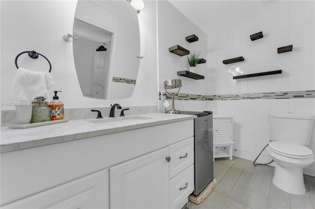 12350 NW 7th Trl, Miami, FL 33182 - bathroom with vanity, tile walls, and tile patterned flooring