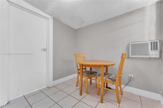 12350 NW 7th Trl, Miami, FL 33182 - dining area featuring a textured ceiling, a wall unit AC, and light tile patterned flooring