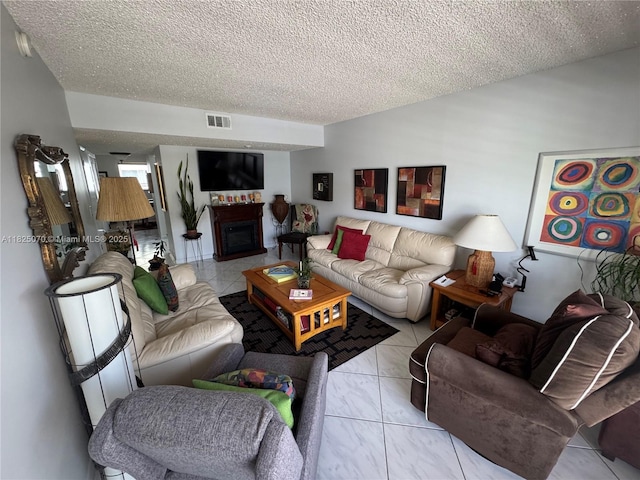 950 SW 104th Ct Unit C-201, Miami, FL 33174 - living room with a textured ceiling and a fireplace