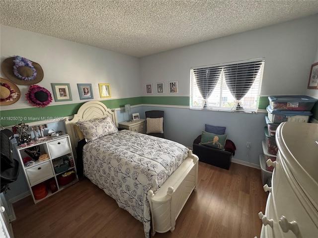 950 SW 104th Ct Unit C-201, Miami, FL 33174 - bedroom with a textured ceiling and dark wood-style flooring