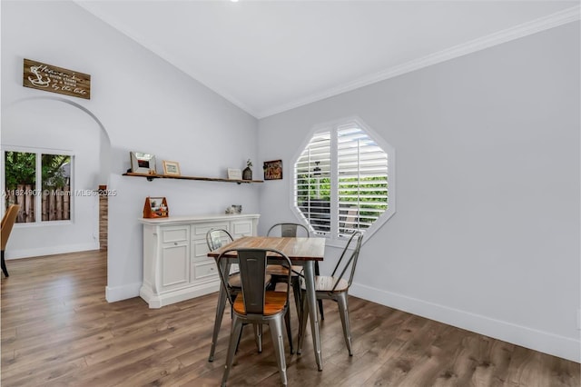 15904 W Wind Cir, Sunrise, FL 33326 - dining area with ornamental molding, lofted ceiling, and wood finished floors