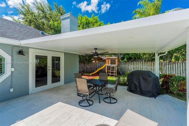 15904 W Wind Cir, Sunrise, FL 33326 - view of patio / terrace featuring french doors, a grill, a playground, outdoor dining space, and a ceiling fan