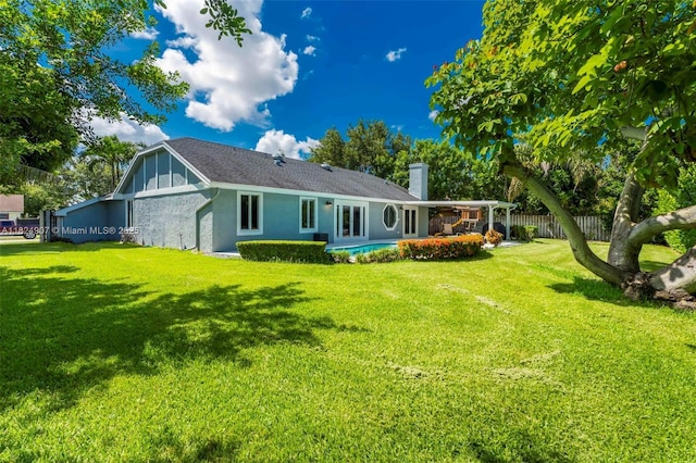 15904 W Wind Cir, Sunrise, FL 33326 - rear view of house with a chimney and stucco siding