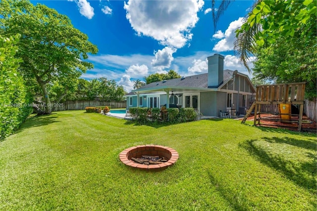 15904 W Wind Cir, Sunrise, FL 33326 - fenced backyard featuring a fire pit and a patio area