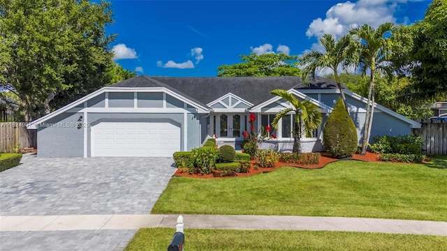 15904 W Wind Cir, Sunrise, FL 33326 - ranch-style house featuring an attached garage, decorative driveway, and stucco siding