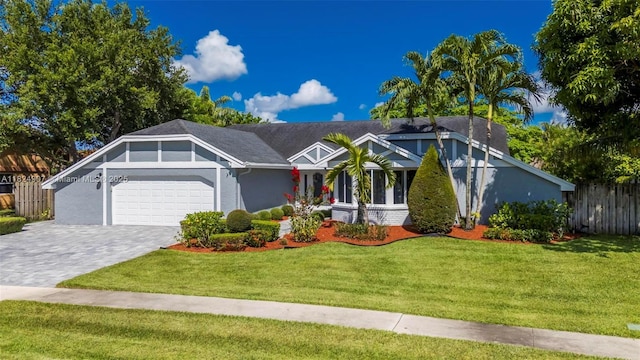 15904 W Wind Cir, Sunrise, FL 33326 - view of front of home with a garage, decorative driveway, and stucco siding