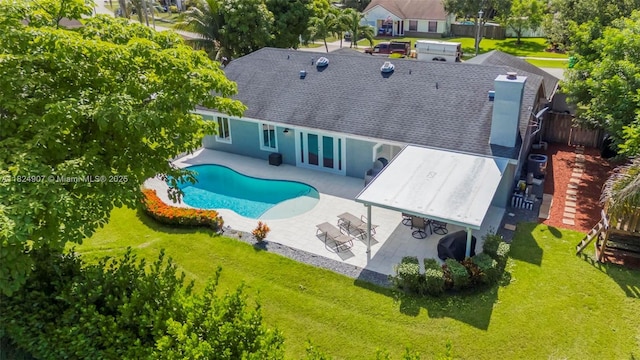 15904 W Wind Cir, Sunrise, FL 33326 - rear view of property featuring a patio, french doors, and roof with shingles