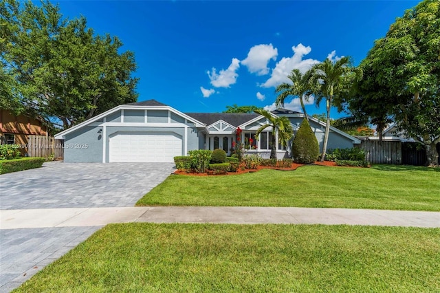 15904 W Wind Cir, Sunrise, FL 33326 - view of front facade featuring a garage, decorative driveway, and stucco siding