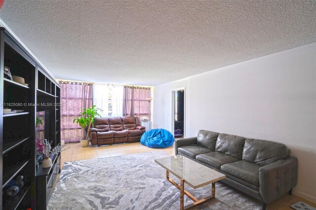 2101 Atlantic Shores Blvd Unit 120, Hallandale Beach, FL 33009 - living room featuring tile patterned floors and a textured ceiling
