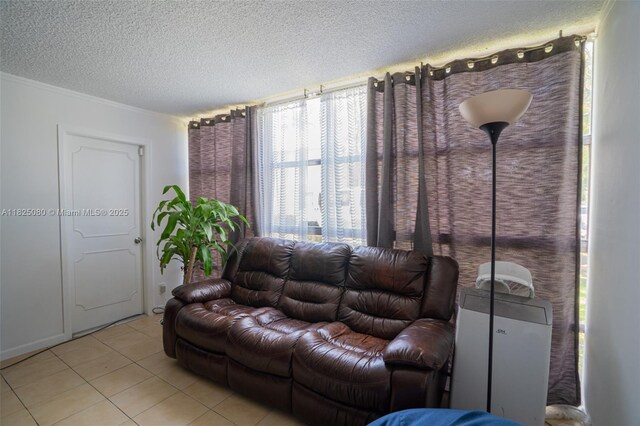 2101 Atlantic Shores Blvd Unit 120, Hallandale Beach, FL 33009 - living area featuring a textured ceiling and light tile patterned flooring