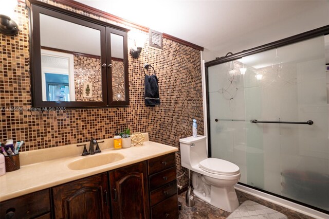 2101 Atlantic Shores Blvd Unit 120, Hallandale Beach, FL 33009 - bathroom with vanity, a shower stall, and tile walls