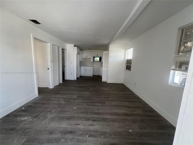 1800 SW 3rd St # B, Miami, FL 33135 - unfurnished living room featuring dark wood-style flooring and healthy amount of natural light