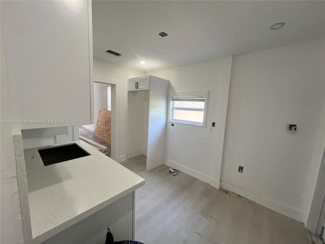 1800 SW 3rd St # B, Miami, FL 33135 - kitchen with light wood-type flooring and light countertops