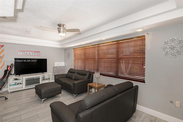 11700 Sheridan St, Pembroke Pines, FL 33026 - living area with a textured ceiling, ceiling fan, and light wood-style floors