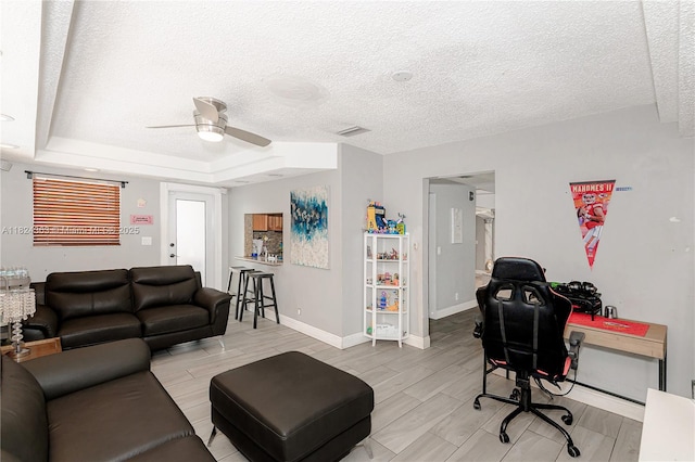 11700 Sheridan St, Pembroke Pines, FL 33026 - office area featuring a ceiling fan, a textured ceiling, wood finish floors, and a tray ceiling