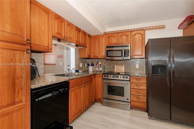 11700 Sheridan St, Pembroke Pines, FL 33026 - kitchen with appliances with stainless steel finishes, brown cabinetry, tasteful backsplash, and light stone counters