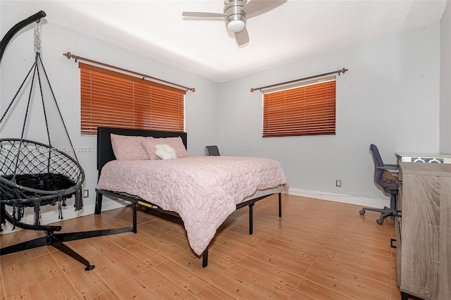 11700 Sheridan St, Pembroke Pines, FL 33026 - bedroom with light wood-style floors and a ceiling fan