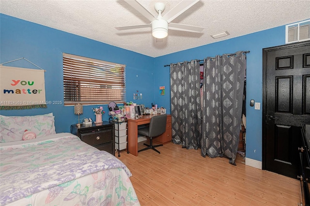 11700 Sheridan St, Pembroke Pines, FL 33026 - bedroom with a textured ceiling, wood finished floors, an office area, and ceiling fan