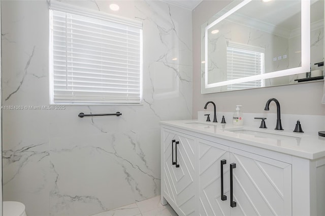 11700 Sheridan St, Pembroke Pines, FL 33026 - bathroom with double vanity, marble look tiles, and crown molding