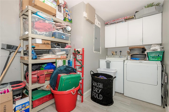 11700 Sheridan St, Pembroke Pines, FL 33026 - washroom with washing machine and clothes dryer, cabinet space, light wood finished floors, and electric panel