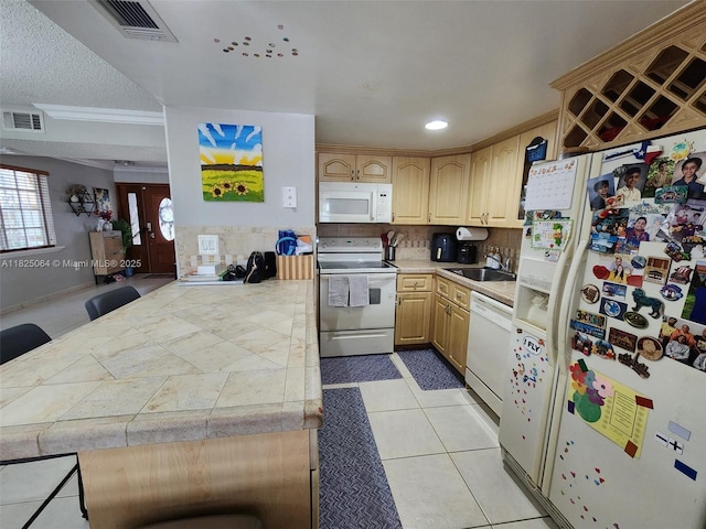 5328 W 26th Ave Unit 112, Hialeah, FL 33016 - kitchen featuring white appliances, backsplash, light brown cabinetry, a peninsula, and recessed lighting