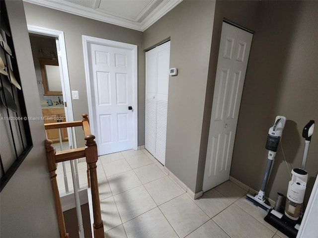 5328 W 26th Ave Unit 112, Hialeah, FL 33016 - hallway featuring crown molding and light tile patterned floors
