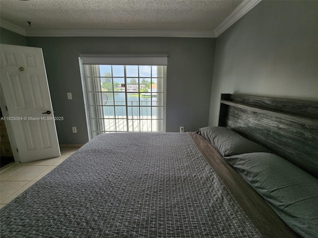 5328 W 26th Ave Unit 112, Hialeah, FL 33016 - bedroom featuring a water view, ornamental molding, light tile patterned floors, a textured ceiling, and access to outside