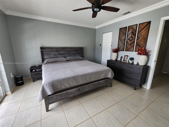 5328 W 26th Ave Unit 112, Hialeah, FL 33016 - bedroom featuring light tile patterned flooring, a textured ceiling, ornamental molding, and ceiling fan