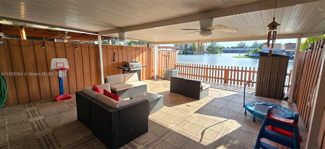 5328 W 26th Ave Unit 112, Hialeah, FL 33016 - view of patio / terrace with a water view, grilling area, an outdoor living space, and a ceiling fan