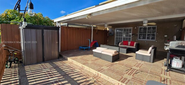 5328 W 26th Ave Unit 112, Hialeah, FL 33016 - view of patio featuring a ceiling fan, outdoor lounge area, and grilling area
