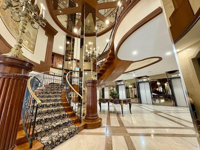 6039 Collins Ave Unit 923, Miami Beach, FL 33140 - common area with a high ceiling and stairway