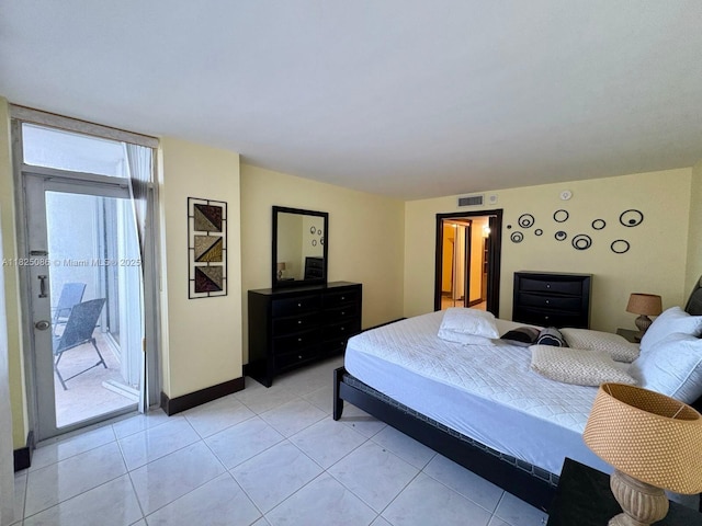 6039 Collins Ave Unit 923, Miami Beach, FL 33140 - bedroom with access to exterior and light tile patterned floors