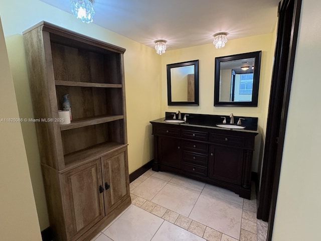 6039 Collins Ave Unit 923, Miami Beach, FL 33140 - bathroom with double vanity and tile patterned floors