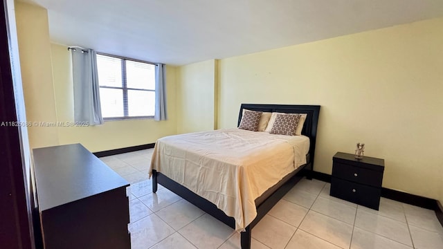 6039 Collins Ave Unit 923, Miami Beach, FL 33140 - bedroom with light tile patterned flooring and baseboards