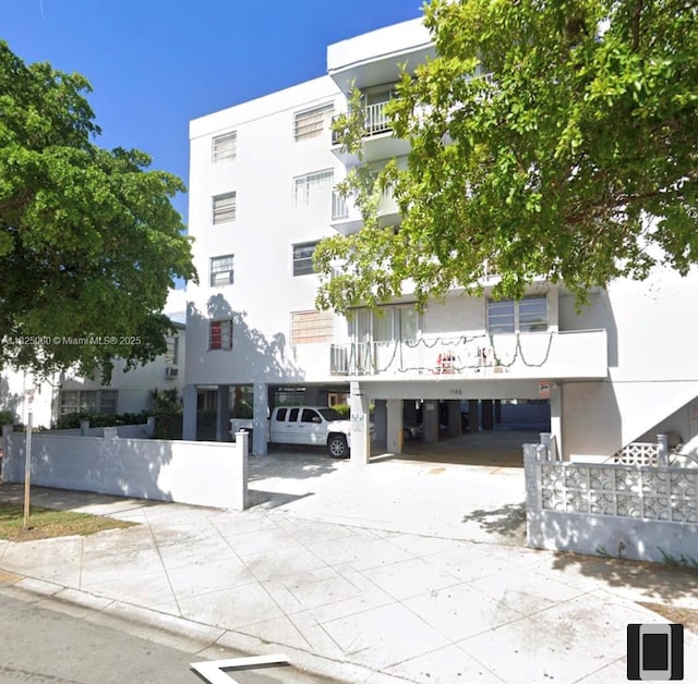 1145 Normandy Dr Unit 304, Miami Beach, FL 33141 - view of building exterior with a carport