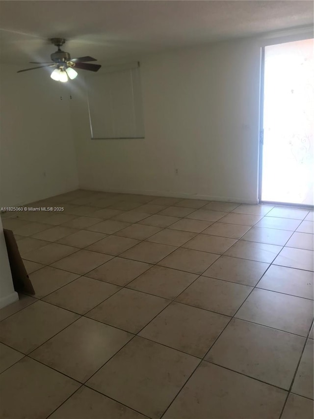1145 Normandy Dr Unit 304, Miami Beach, FL 33141 - spare room with light tile patterned floors and a ceiling fan