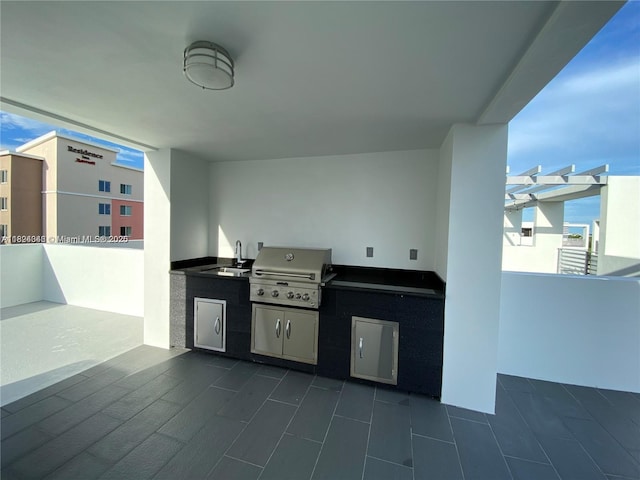 9181 NW 33rd St Unit 9181, Doral, FL 33172 - view of patio featuring an outdoor kitchen and a sink