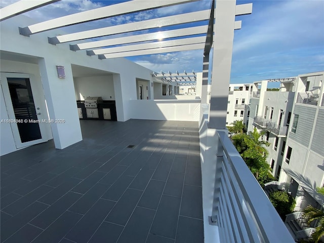 9181 NW 33rd St Unit 9181, Doral, FL 33172 - view of patio with an outdoor kitchen, a pergola, and a residential view