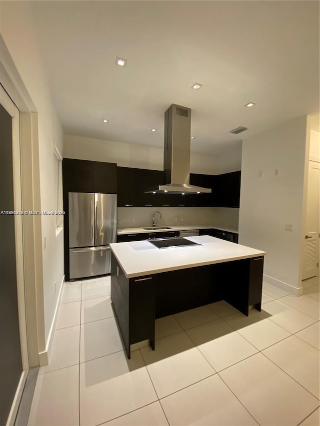 9181 NW 33rd St Unit 9181, Doral, FL 33172 - kitchen featuring freestanding refrigerator, island range hood, dark cabinets, modern cabinets, and light countertops