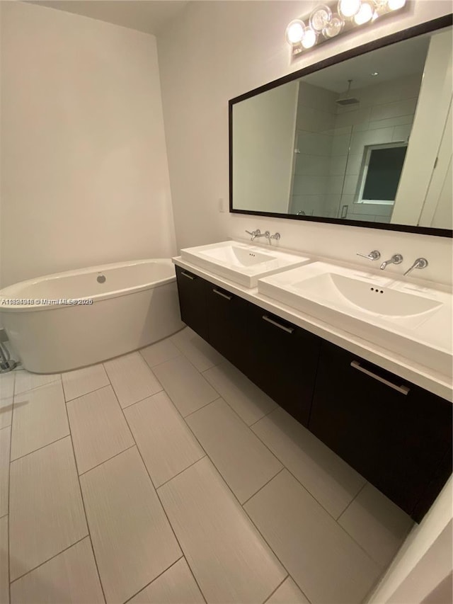 9181 NW 33rd St Unit 9181, Doral, FL 33172 - bathroom with double vanity, a soaking tub, and tiled shower