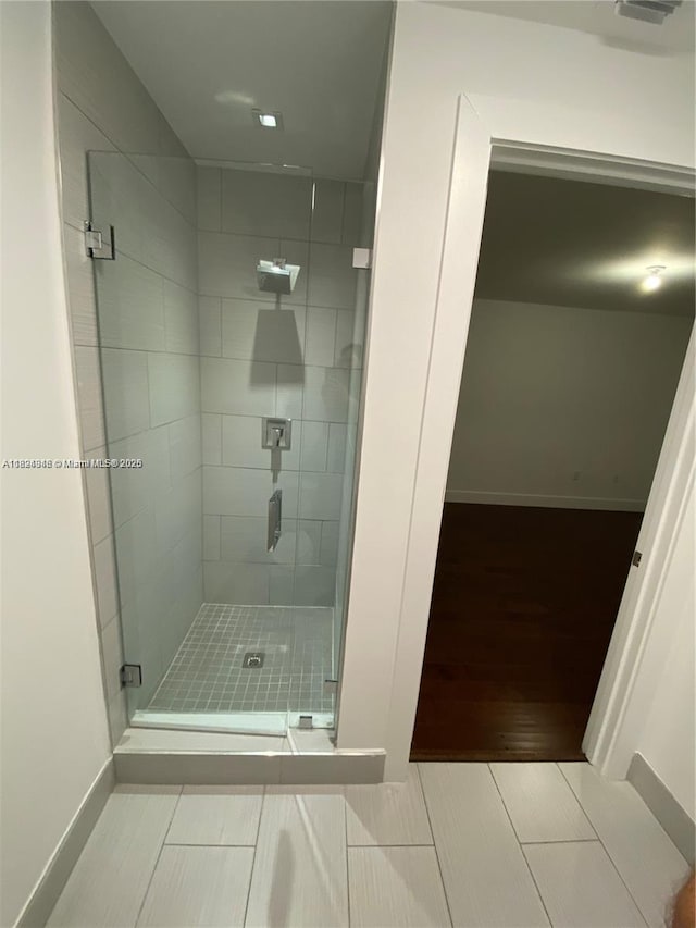 9181 NW 33rd St Unit 9181, Doral, FL 33172 - bathroom featuring a stall shower and baseboards
