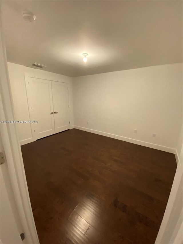 9181 NW 33rd St Unit 9181, Doral, FL 33172 - spare room with dark wood-type flooring and a smoke detector
