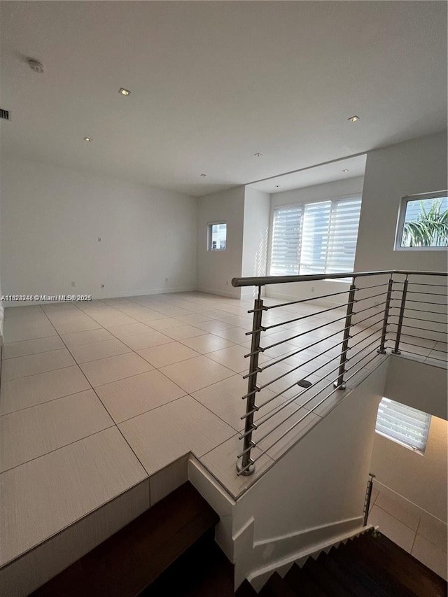 9181 NW 33rd St Unit 9181, Doral, FL 33172 - staircase featuring plenty of natural light, recessed lighting, and tile patterned floors