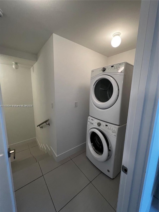 9181 NW 33rd St Unit 9181, Doral, FL 33172 - laundry room with estacked washer and dryer and light tile patterned floors
