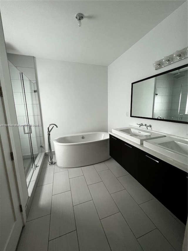 9181 NW 33rd St Unit 9181, Doral, FL 33172 - full bath with a stall shower, a freestanding bath, and double vanity